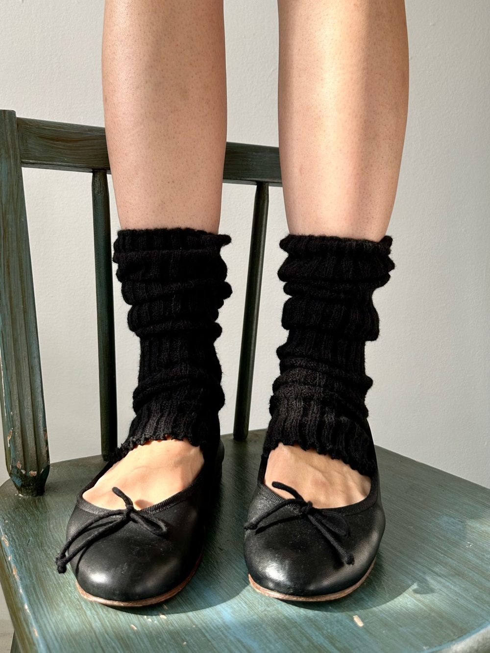 Black acrylic ribbed knit leg warmers
